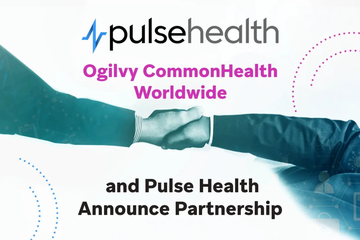 Two professionals in business suits clasp hands beneath the Pulse Health logo and announcement text on a clean white background accented with dotted magenta and blue semi-circles.
