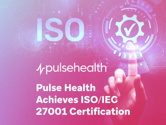 Finger touching a glowing gear icon with a checkmark overlay on a pink-to-purple gradient, plus the Pulse Health logo and the text “Pulse Health Achieves ISO/IEC 27001 Certification.”