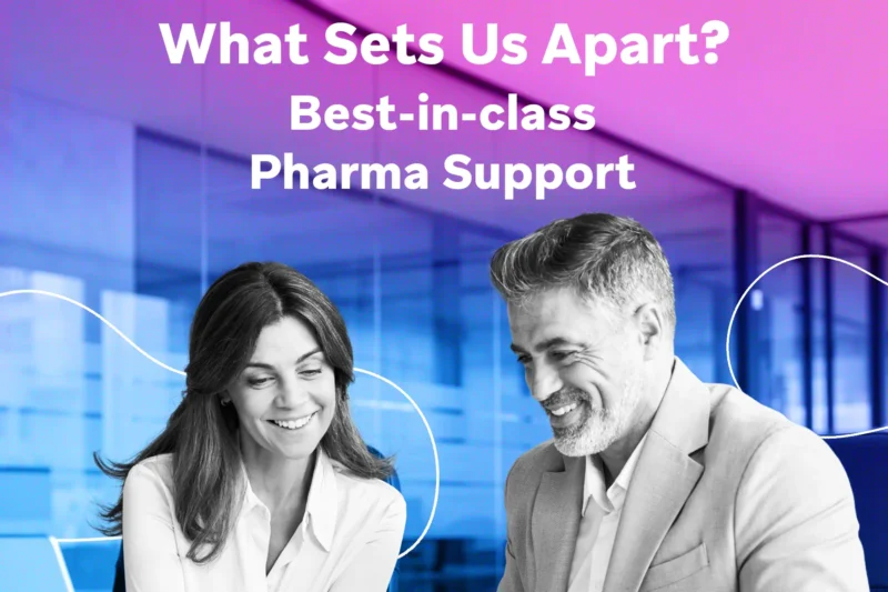 Two smiling professionals in business attire collaborate at a desk in a glass-walled office tinted with pink and purple hues, with large white text above asking “What Sets Us Apart?”