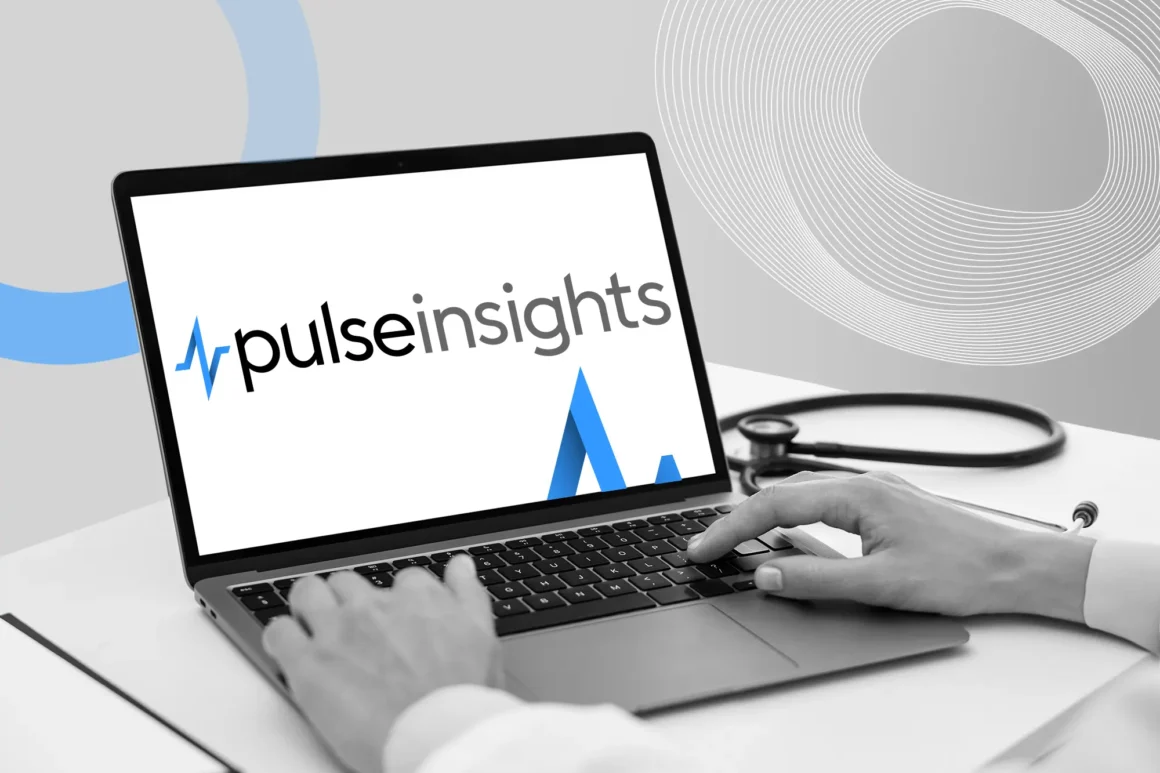 A sleek laptop screen showcases the new “pulseinsights” logo against a clean white interface, with a stethoscope casually placed beside it. Hands poised over the keyboard hint at user engagement, while abstract gray-and-blue brand elements in the background convey a modern analytics rollout.