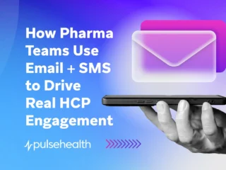 A hand holding a smartphone with glowing email icons, symbolizing digital communication strategies that enhance healthcare professional engagement through email and SMS.